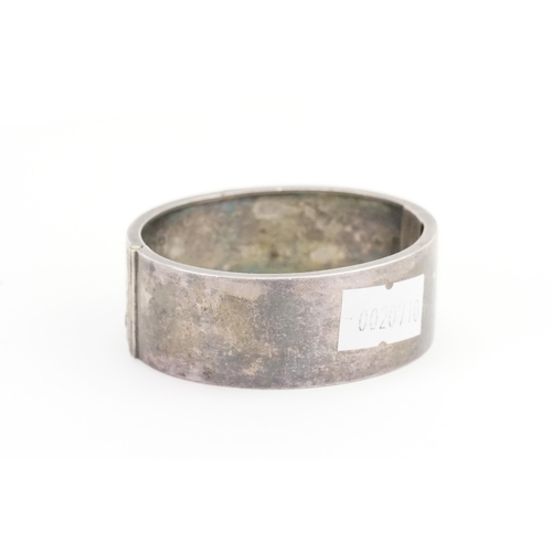 102 - A Victorian engraved Silver Bangle. Weighing: 25 grams.