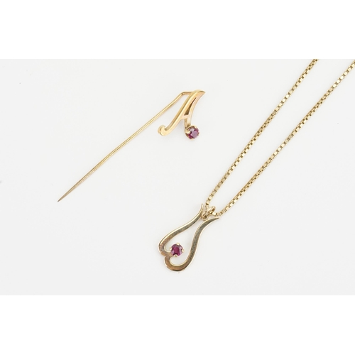 105 - A Paul Markey, Ruby set 9ct Gold Pendant on a chain set with a along with a matching Pin Brooch. Wei... 