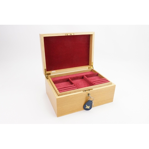 173 - A Pine Red inlaid Jewellery Box.