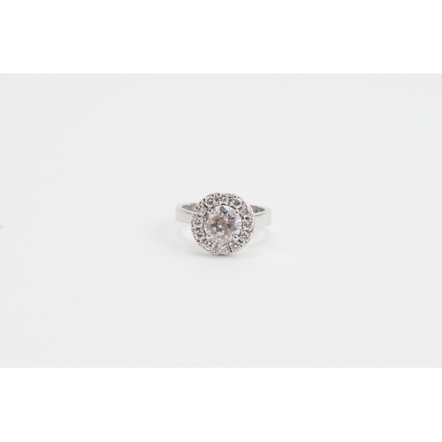 145 - A 14ct White Gold marked Diamond Ring set with surrounding Diamonds. 1.1ct Central Diamond, along wi... 