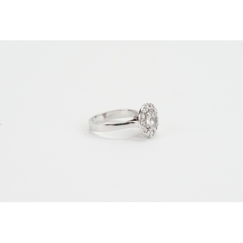 145 - A 14ct White Gold marked Diamond Ring set with surrounding Diamonds. 1.1ct Central Diamond, along wi... 