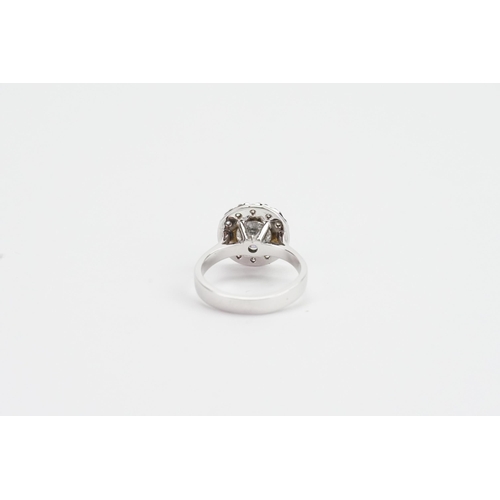 145 - A 14ct White Gold marked Diamond Ring set with surrounding Diamonds. 1.1ct Central Diamond, along wi... 