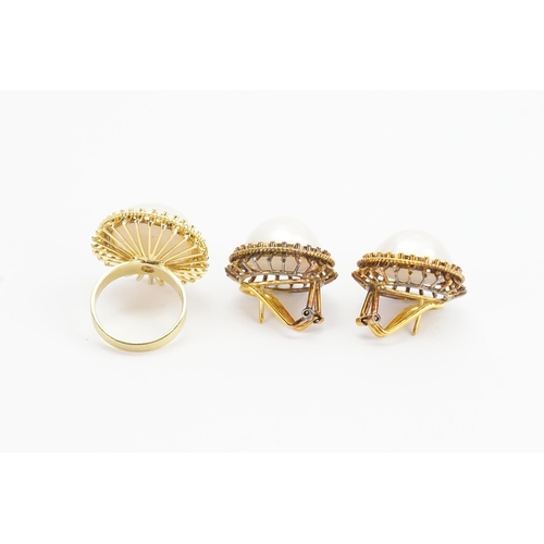 146 - A set of 14ct Gold Pearl set Ring and Earrings. Size M/N. Weight: 27.9 grams.