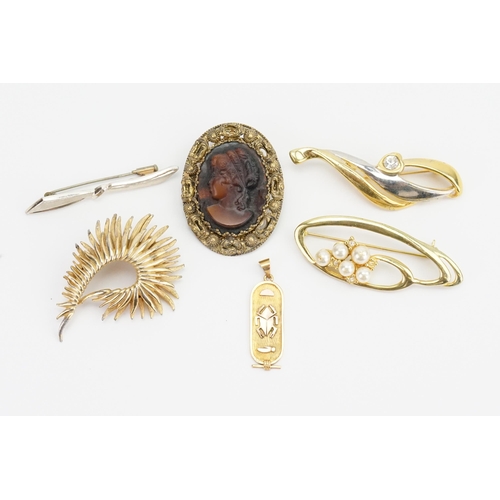 195 - A Gold Scarab Pendant along with Five Costume Jewellery Brooches.