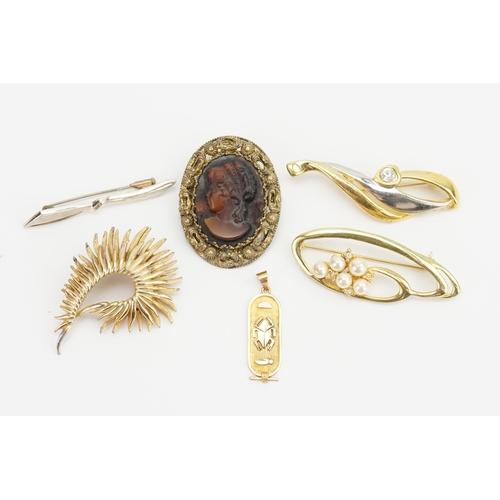 195 - A Gold Scarab Pendant along with Five Costume Jewellery Brooches.