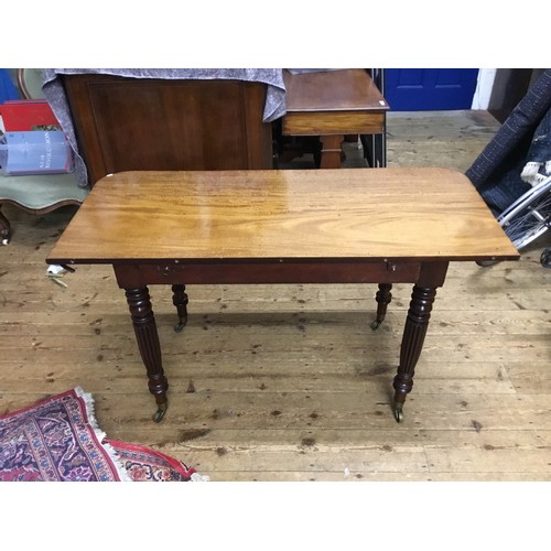 602 - A Georgian Mahogany Twin Pillared Dining Table Resting on Fluted Legs with Brass Castors, fitted wit... 