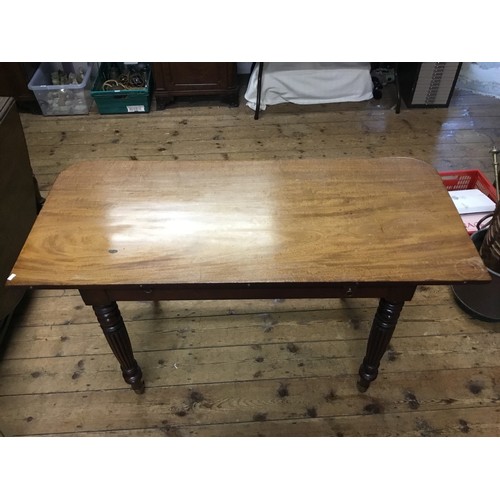 602 - A Georgian Mahogany Twin Pillared Dining Table Resting on Fluted Legs with Brass Castors, fitted wit... 