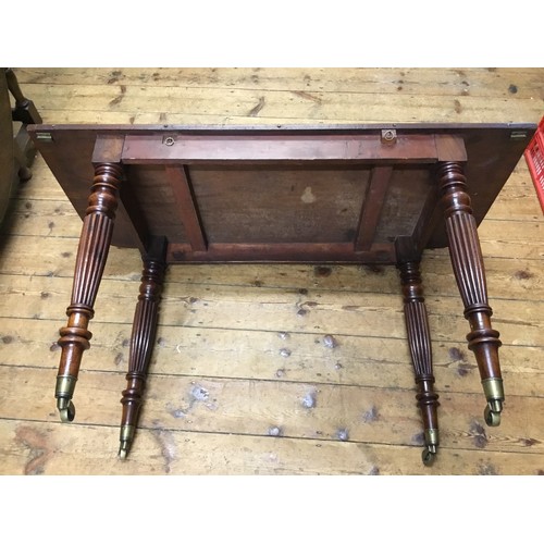 602 - A Georgian Mahogany Twin Pillared Dining Table Resting on Fluted Legs with Brass Castors, fitted wit... 