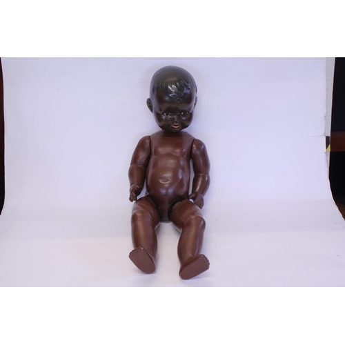 550 - A Large Celluloid Brown Coloured Doll of a Boy. Measuring: 70cms Tall. (As Found).