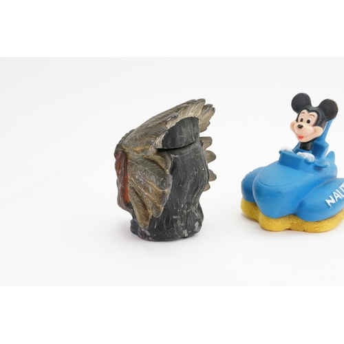 601 - A 20th Century Cast Iron Money Box depicting an Indian's Head & a Mickey Mouse Nautilus Sponge.