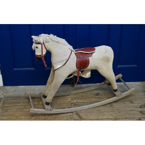 607 - A 1960s Velour Rocking Horse on Stand. Measuring: 108cms long x 75cms high.