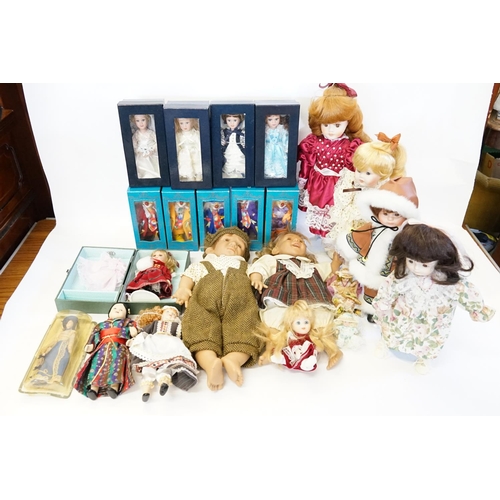 542 - A Collection of Dolls along with a collection of boxed Dolls & Clowns. 15+ in Total.