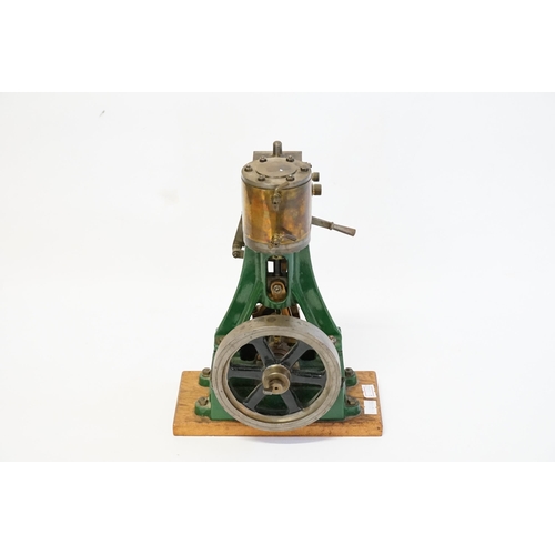 592 - A Large model of a Stationary Steam Engine mounted on a Wooden Plinth. Standing: 27cms High.