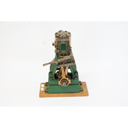 592 - A Large model of a Stationary Steam Engine mounted on a Wooden Plinth. Standing: 27cms High.