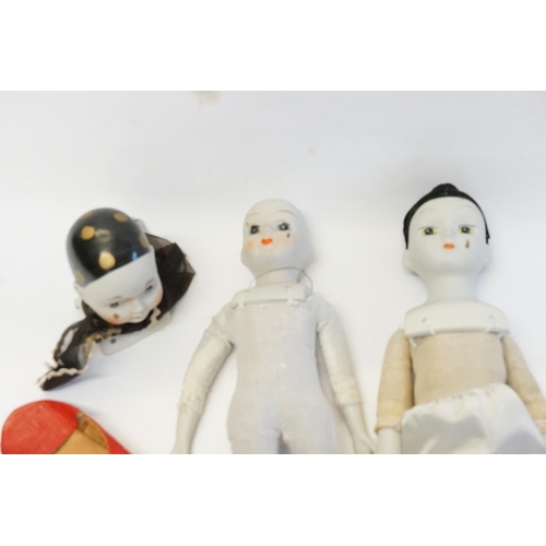 569 - Two Vintage Original Porcelain Dolls along with a Porcelain Doll's Head & a pair of shoes.