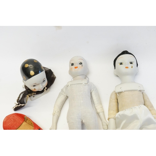 569 - Two Vintage Original Porcelain Dolls along with a Porcelain Doll's Head & a pair of shoes.