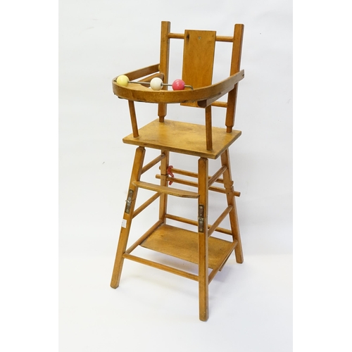 576 - A 1950s Dolls High Chair on a Fold Over Stand.