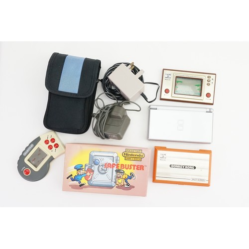 628 - A Nintendo DS Light with three Games along an Original Boxed Pocket Size Nintendo Safebuster & two N... 