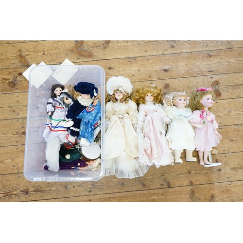 563 - A Collection of Dolls some on stands by The 