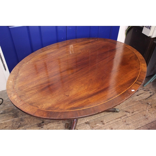 582 - An Oval Topped Regency Designed Fold Over Topped Dining Table with Cross Banding & Pad Feet. Measuri... 