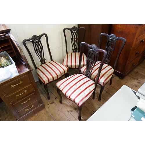 583 - A Set of Four Pierced Back & Floral Carved Drawing Room Chairs resting on shaped legs.