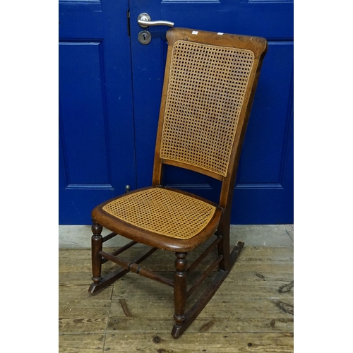 606 - A Victorian Oak Framed Rocking Nursing Chair with Bergere Seat & Back.