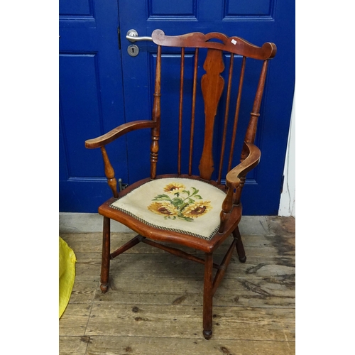 615 - A Stained as Beech Elbow Chair resting on turned legs, Cross Stretcher & Tapestry Seat.