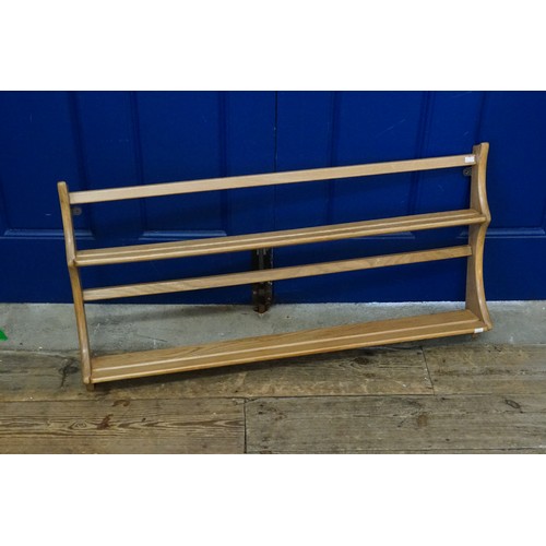 626 - A Ercol light oak plate rack. 97cm wide x 50cm high x 14cm deep.