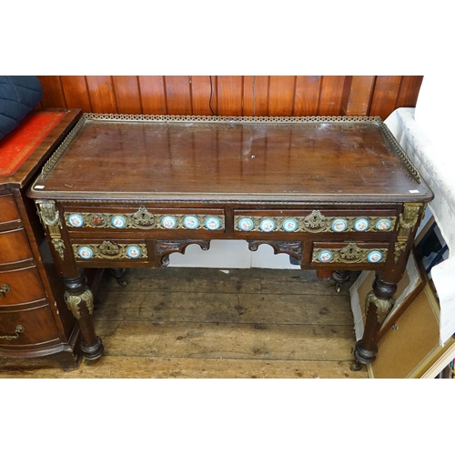 628 - A Louis Philippe style porcelain mounted writing desk, with gilt metal front and beading, resting on... 