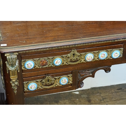 628 - A Louis Philippe style porcelain mounted writing desk, with gilt metal front and beading, resting on... 