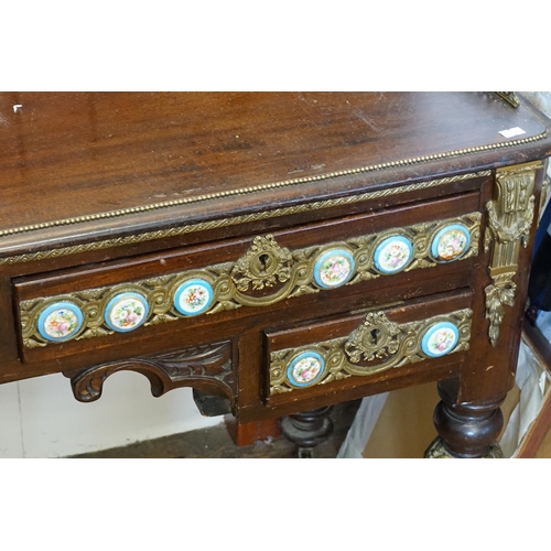 628 - A Louis Philippe style porcelain mounted writing desk, with gilt metal front and beading, resting on... 