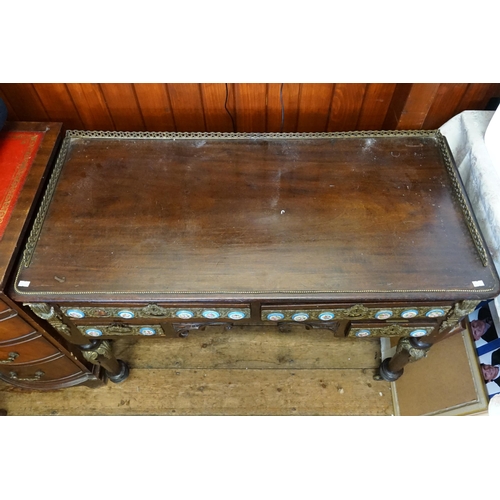 628 - A Louis Philippe style porcelain mounted writing desk, with gilt metal front and beading, resting on... 