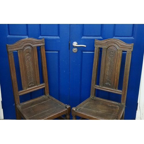 637 - A pair of antique oak side chairs, with carved back and turned legs, stretchers, with a good colour.