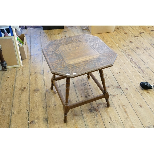 638 - A leaf decorated carved table, resting on turned legs. 53cm x 53cm x 57cm.