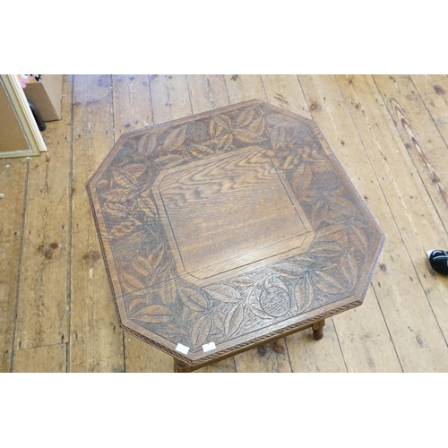 638 - A leaf decorated carved table, resting on turned legs. 53cm x 53cm x 57cm.