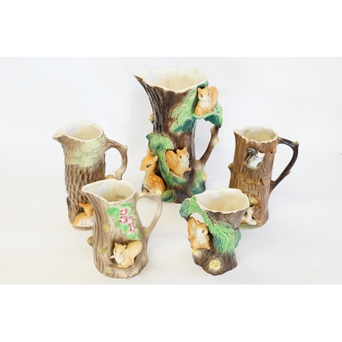 478 - A collection of Hornsea jugs, decorated with squirrels and fawn.