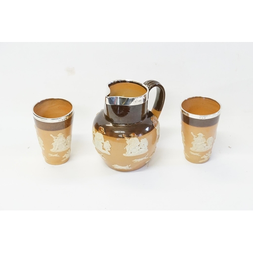 546 - A Doulton Salt Glazed Two-Tone Pottery Lemonade Jug with Beakers with Silver Mounts decorated with T... 