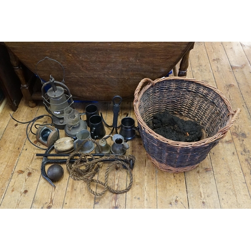 688 - A Basket containing a Storm Lamp, Oil Lamps, Brass Bell, Anchor, etc.