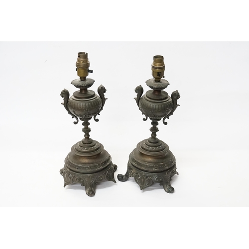 677 - A Pair of French Table Lamps decorated with Lions Heads, Floral Swags & resting on a Shaped Base. Me... 