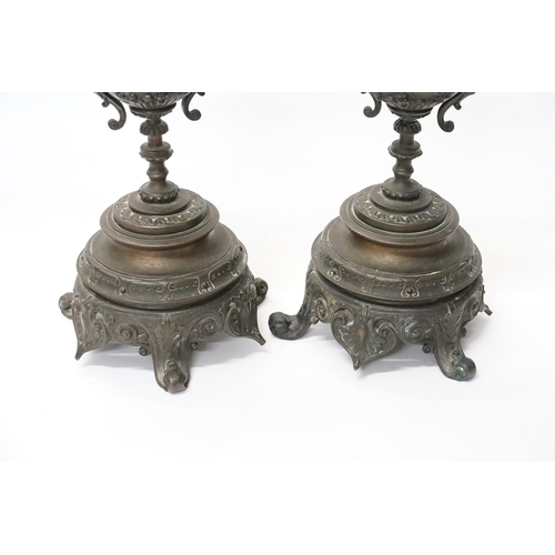 677 - A Pair of French Table Lamps decorated with Lions Heads, Floral Swags & resting on a Shaped Base. Me... 