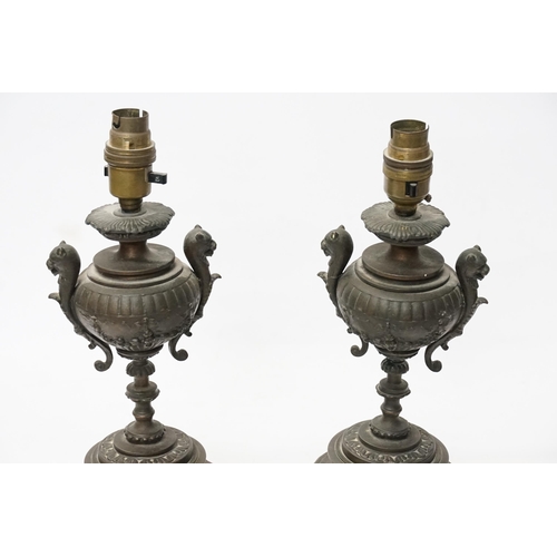 677 - A Pair of French Table Lamps decorated with Lions Heads, Floral Swags & resting on a Shaped Base. Me... 