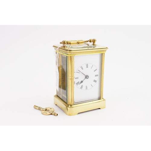 320 - A Brass Cased Four Plate Carriage Clock with Visible Escapement, Swing Handle with Original Receipt ... 