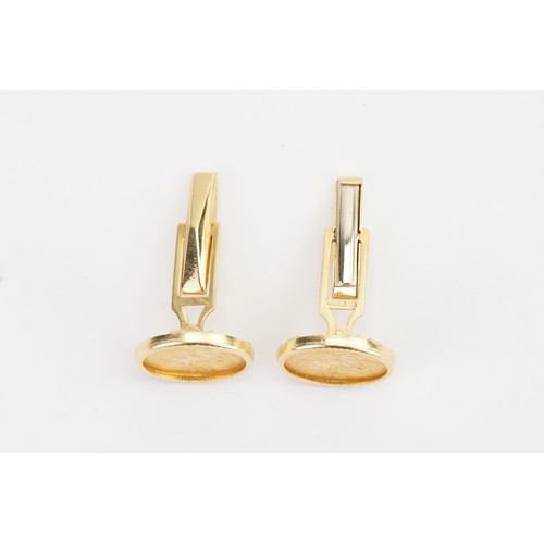 416 - A pair of 1911 Quarter Sovereigns made into 18ct Gold cufflinks. Weight 12.5g gross.