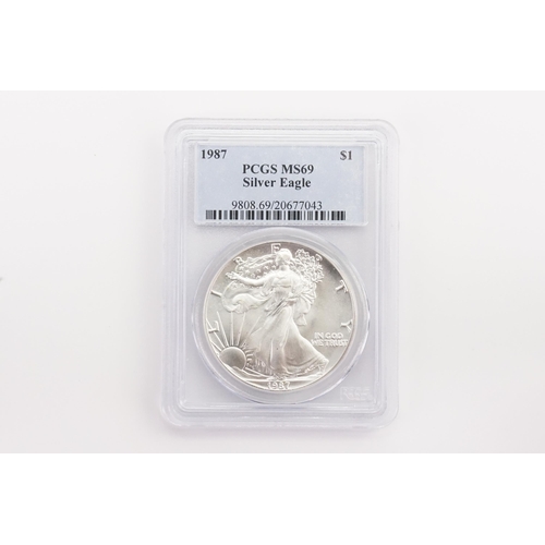 424 - A 1987 Silver eagle $1 Liberty coin, graded by PCGS MS69.