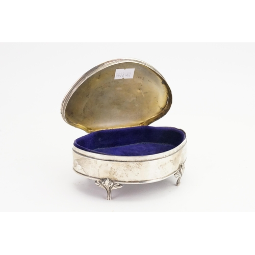 28 - A 1920s Silver engraved jewellery casket with purple velour. Birmingham. Weight 215g.