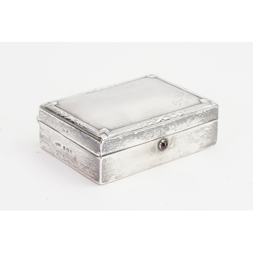 86 - A Rectangular Silver Rib & Edged Cigarette Box with a Cavachon Thumb Piece.