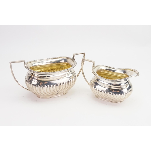 67 - A Silver Sugar Basin & Cream Jug of Georgian inspiration, Swirl & Gadrooned Decoration. Weighing: 52... 