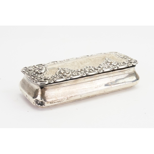 69 - A Silver Oblong Dressing Table Box with embossed decoration. Weighing: 102 grams.