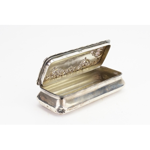 69 - A Silver Oblong Dressing Table Box with embossed decoration. Weighing: 102 grams.