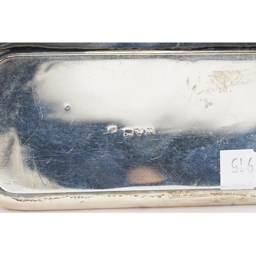 69 - A Silver Oblong Dressing Table Box with embossed decoration. Weighing: 102 grams.